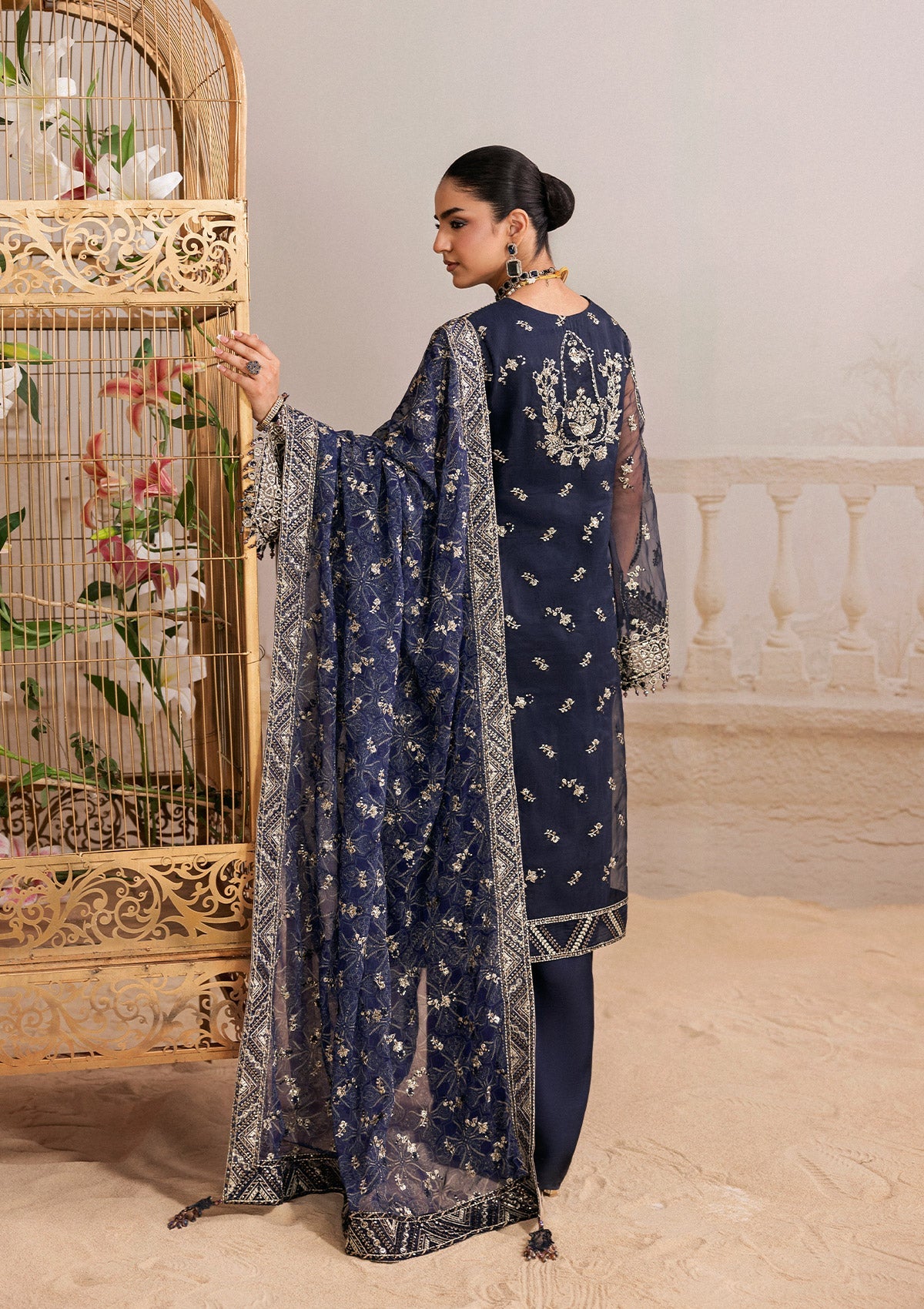 "Detailed shot of the luxury dupatta from the Aik Shaam B2604 ensemble, showcasing fine embroidery sprays and neatly finished border trims."