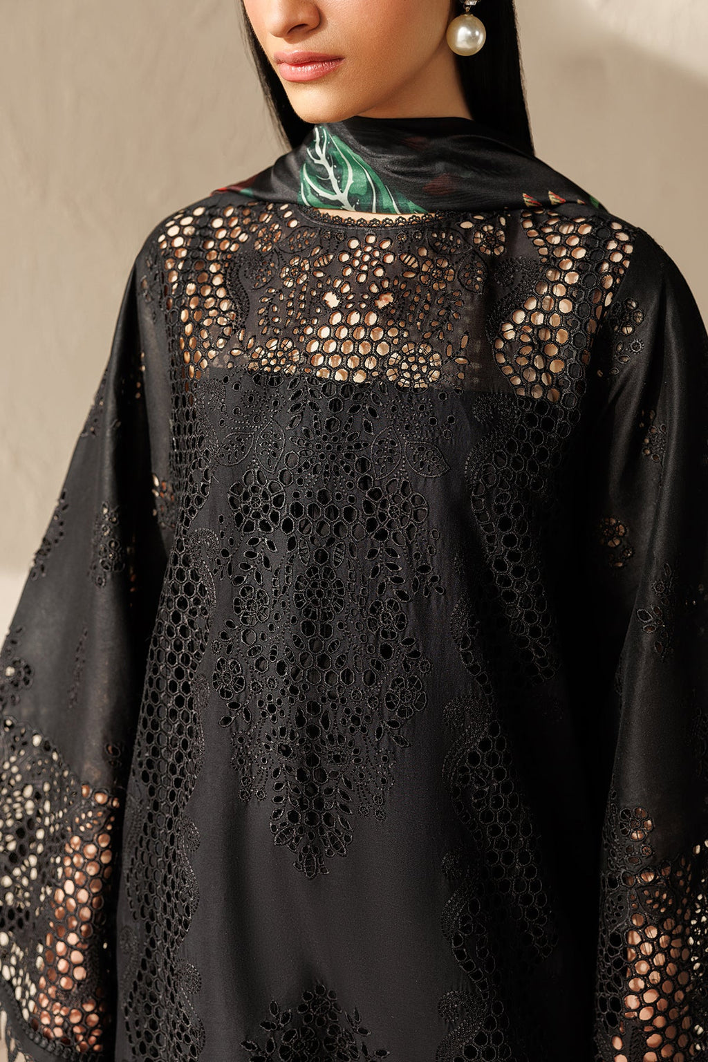 "Close-up detailing on Embroidered Lawn UF-4521 dress, highlighting fine threadwork embroidery layouts, schiffli cutwork accents, and delicate neckline finishes."