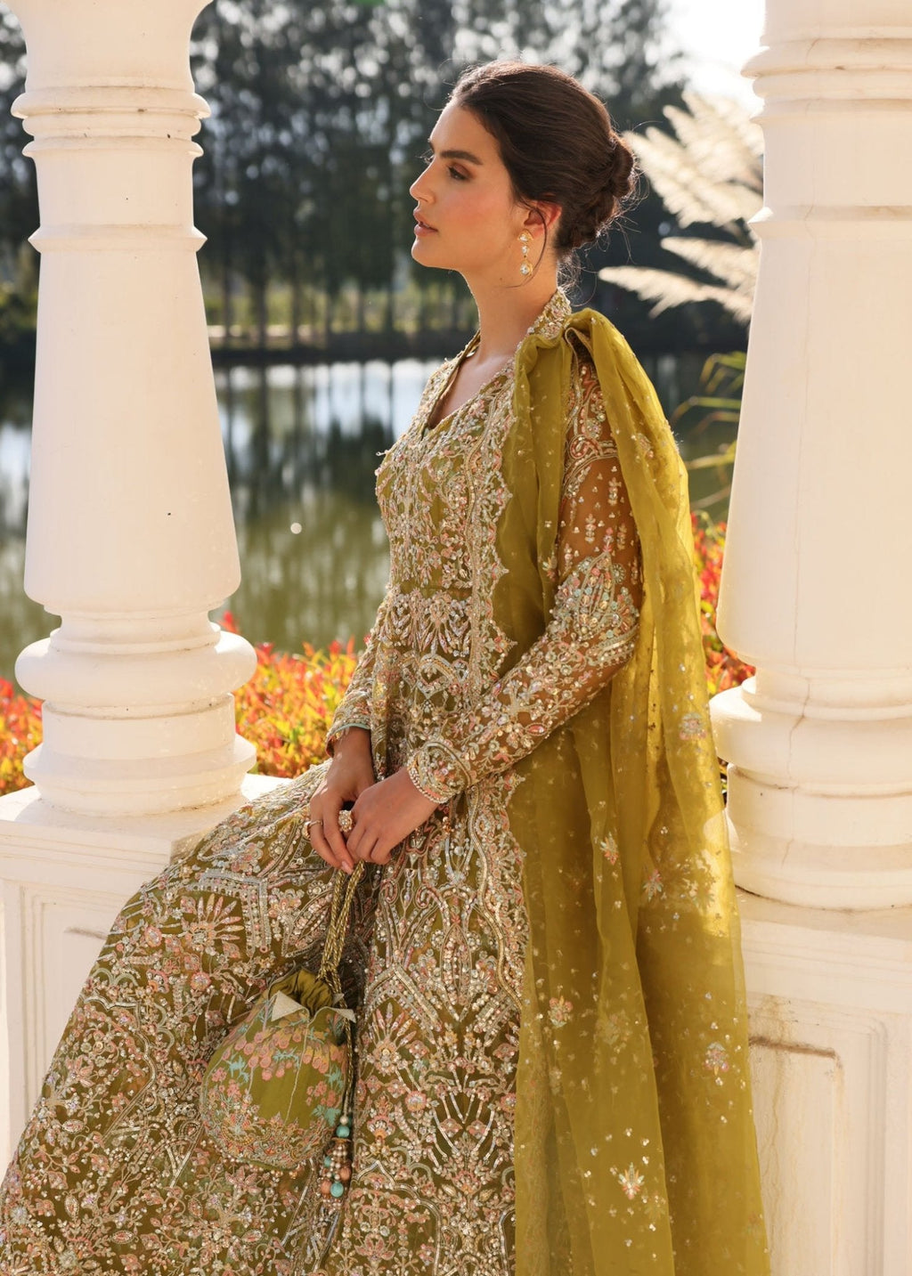 "Detailed shot of the luxury organza dupatta from the Kanwal Malik Yashma collection, emphasizing the ethereal translucent texture, light fluid drape, and its premium dense-to-light gradient sequin spray layout."