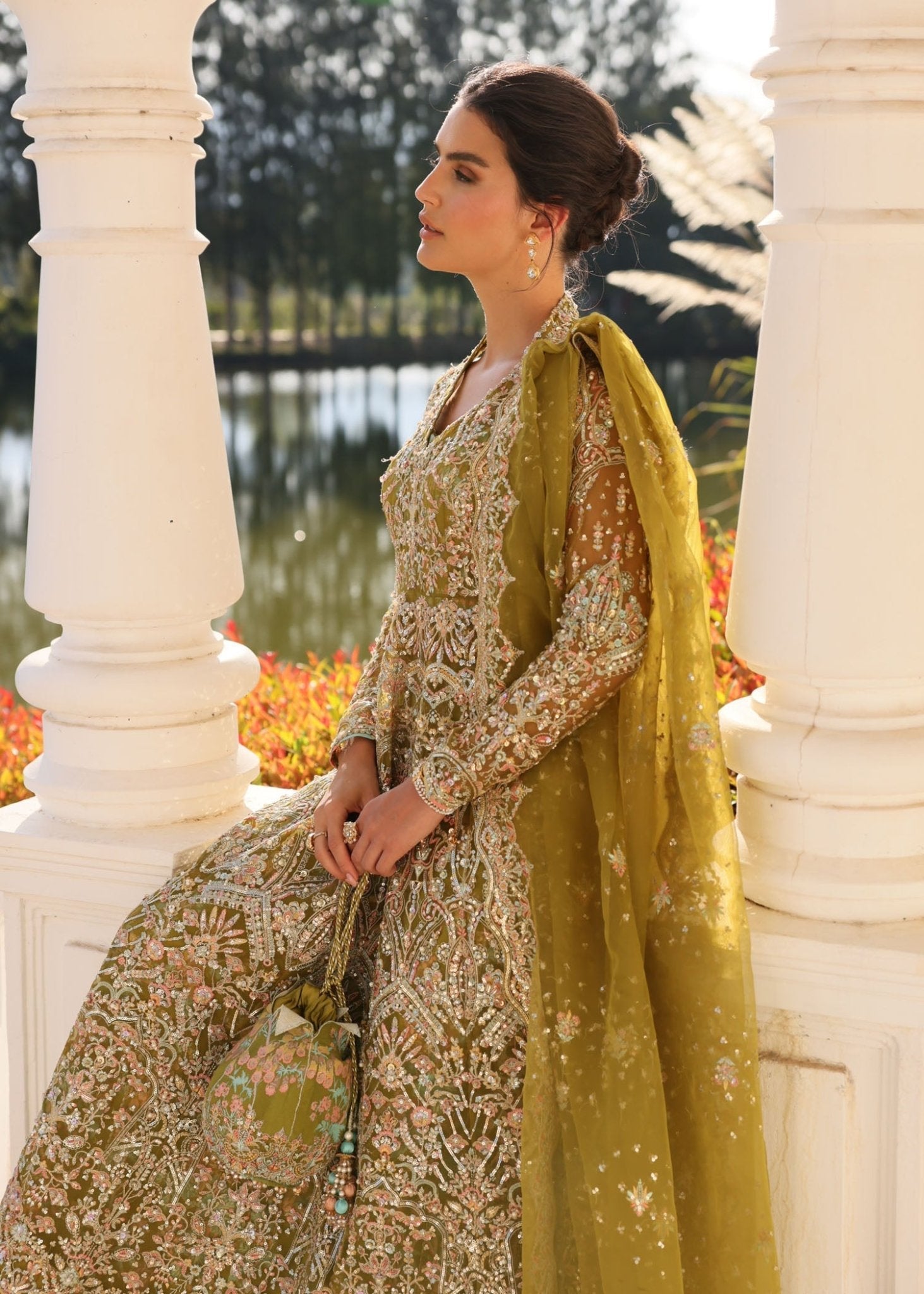 "Detailed shot of the luxury organza dupatta from the Kanwal Malik Yashma collection, emphasizing the ethereal translucent texture, light fluid drape, and its premium dense-to-light gradient sequin spray layout."