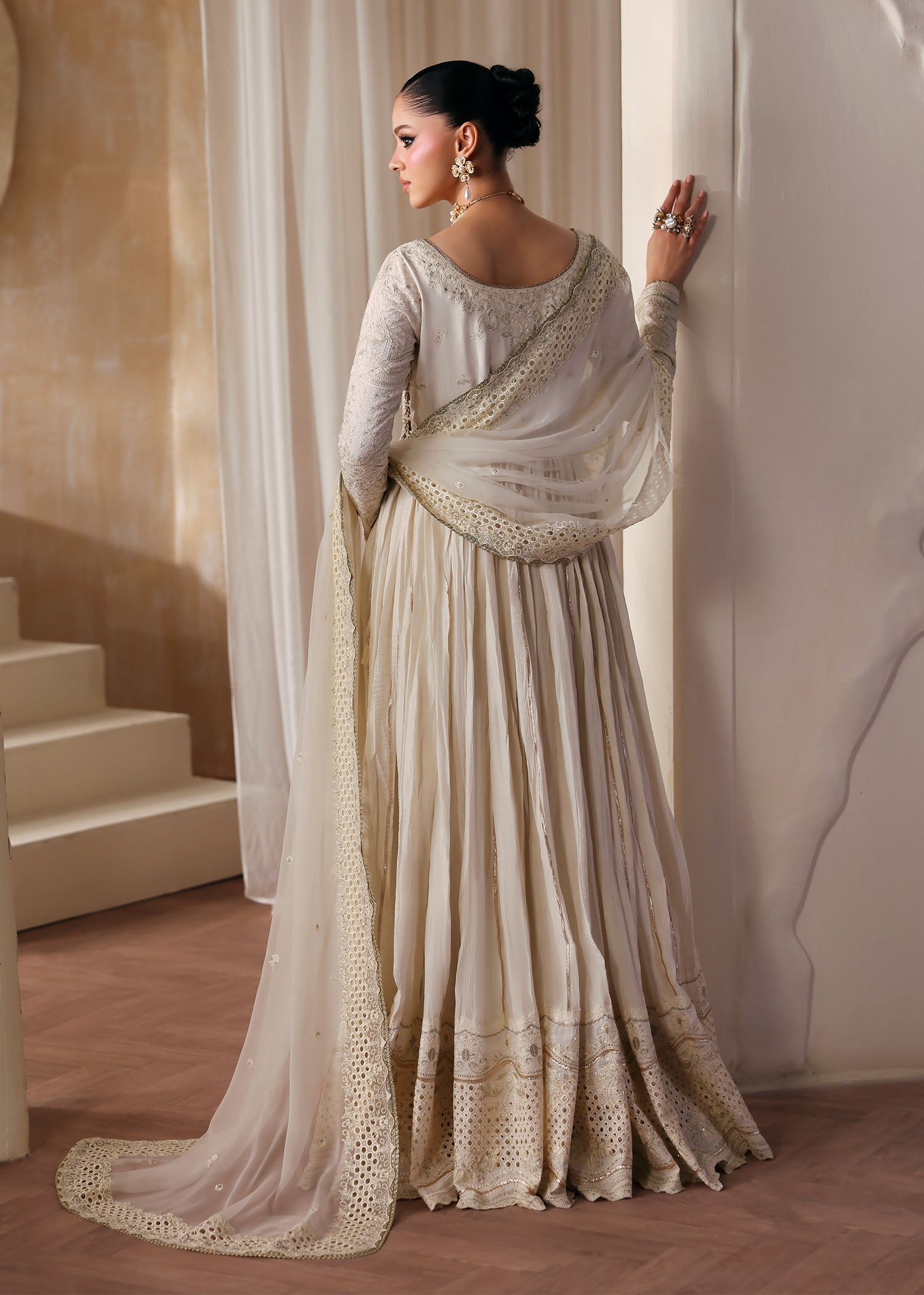 "Rear profile and drape view of the matching ivory dupatta from the Kanwal Malik Nira collection, emphasizing the premium translucent texture, light embroidered spray, and neat scalloped block borders."