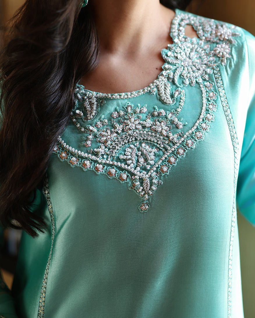 "Detailed drape view of the fluid luxury embroidered dupatta paired with the Mushq Neyla formal suit from Mirha Collections."
