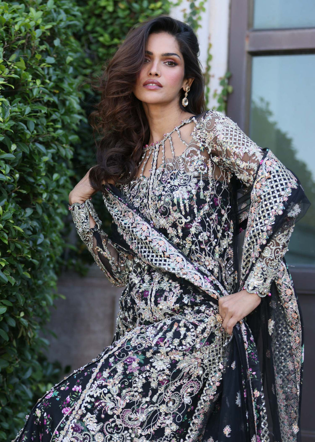 "Close-up premium detailing on the Kanwal Malik Rina plum shirt, highlighting the stunning layout of intricate traditional Ada handwork, sparkling crystal embellishments, and fine embroidery on the neckline and front panels."