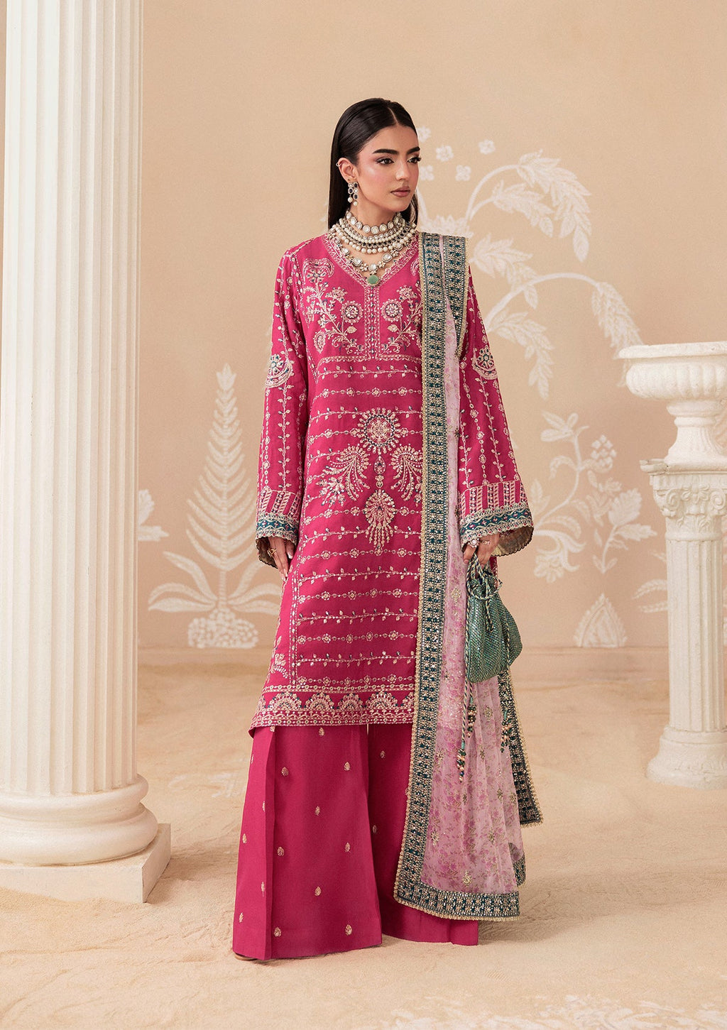 "Lower frame and sleeve focus of Aik Shaam Look B2606, emphasizing multi-textured embroidered patch borders, precise stitching lines, and tailored cuff finishes."