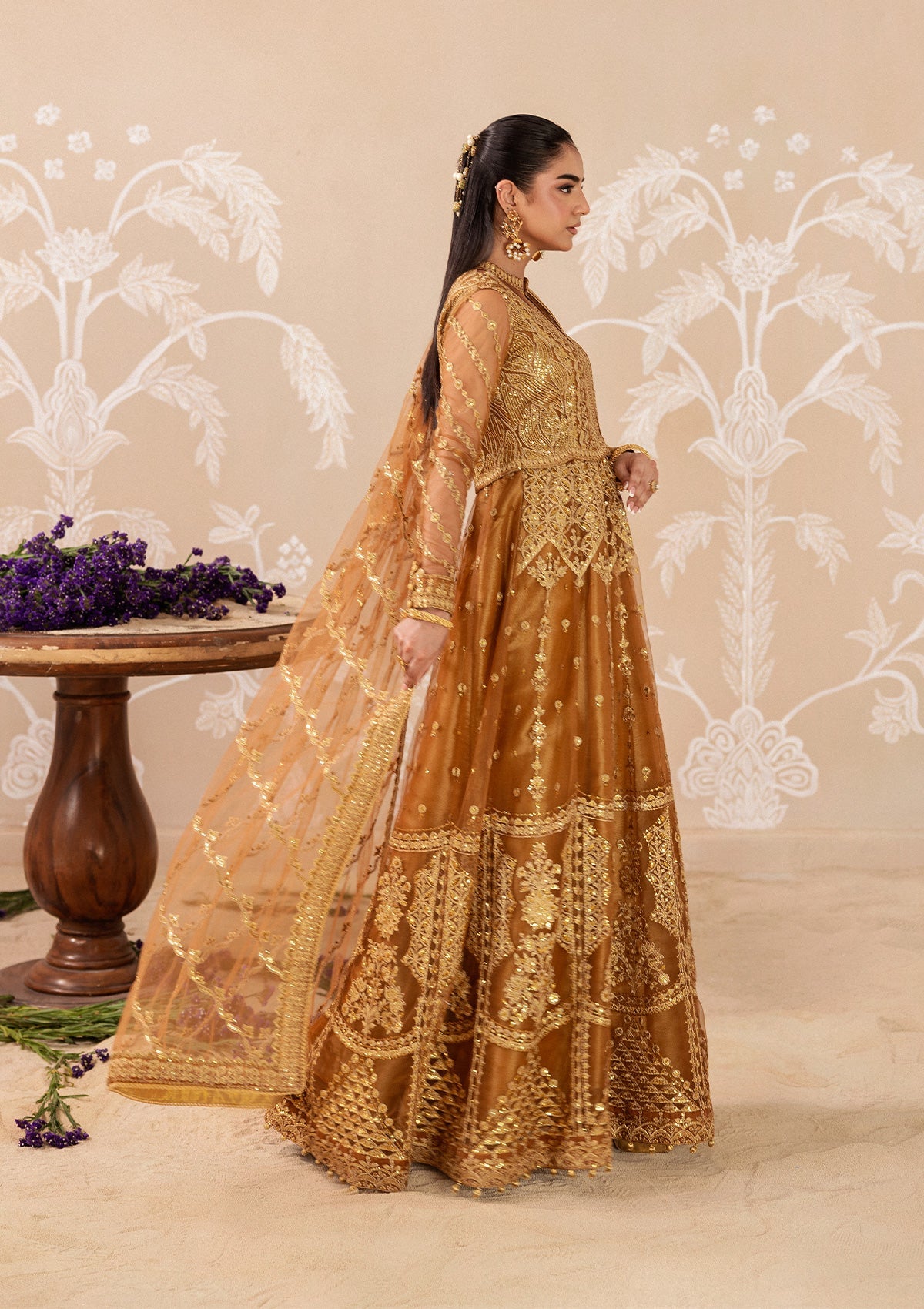 "Lower frame and sleeve focus of Aik Shaam Look B2603, emphasizing multi-textured embroidered patch borders, precise stitching lines, and tailored cuff finishes."