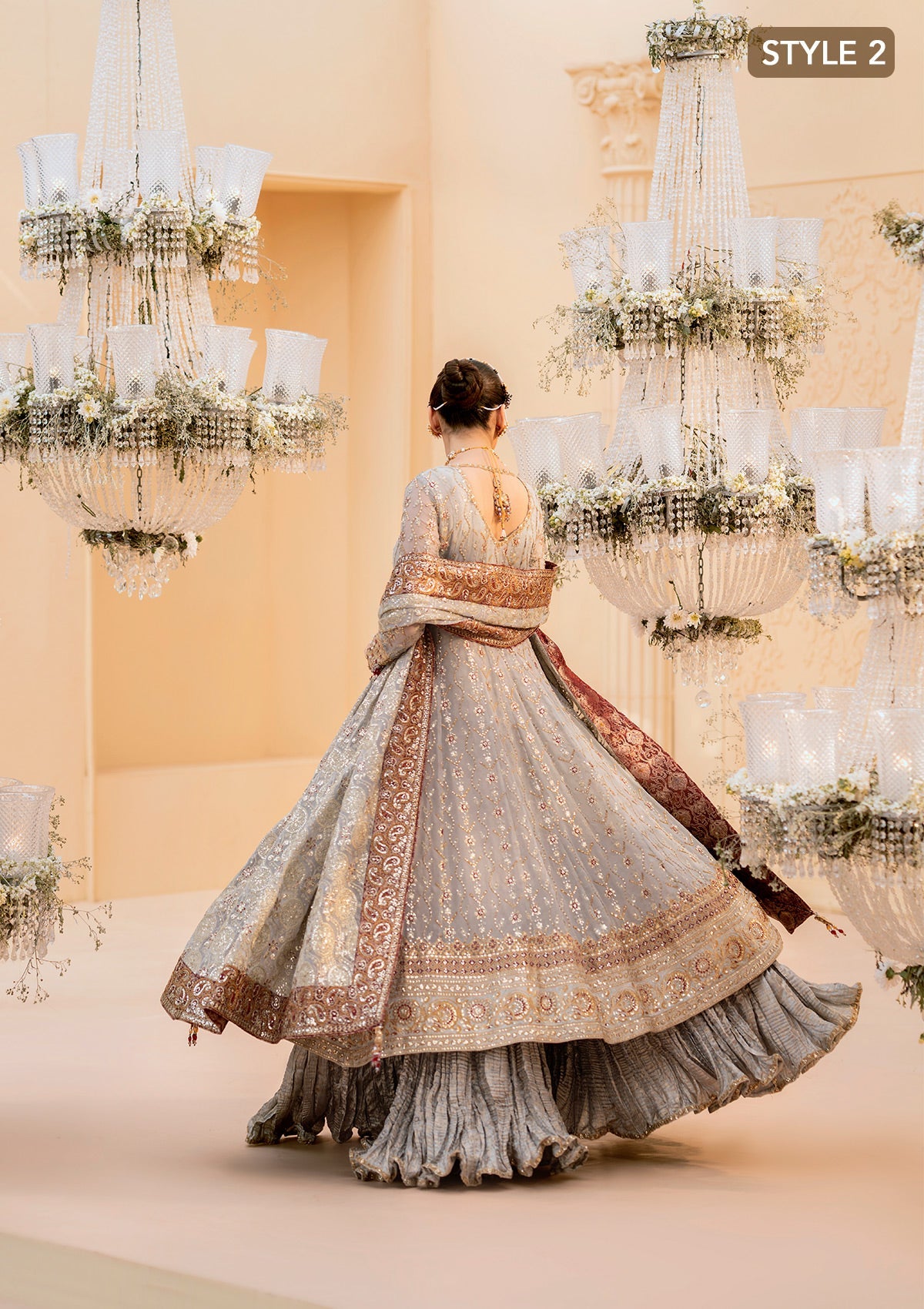 "Lower frame and sleeve profile view of the Aik Wedding Festive Look A2502 ensemble, focusing on the multi-layered embroidered organza patches, clean structural stitching, and elegant sleeve border finishes."