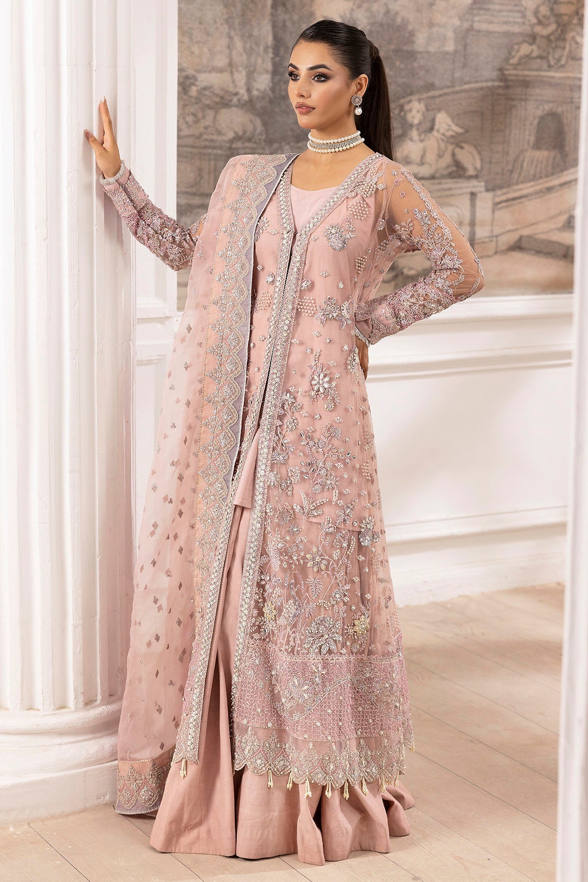 "Focus on the unstitched organza patch borders and sleeve trims of Motifz 4935-AHLAM, displaying multi-textured embroidered borders and rich fabric textures."
