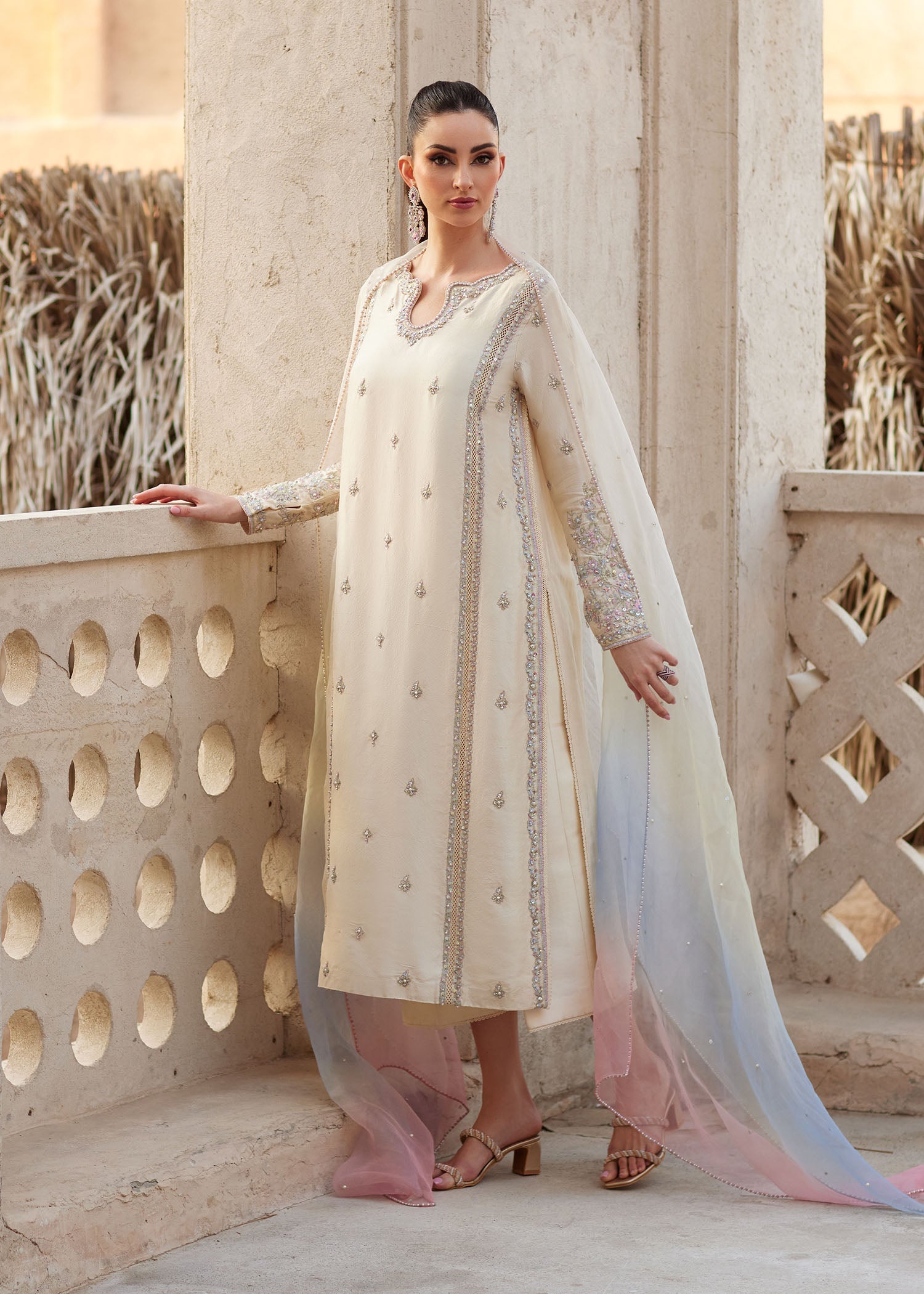 "Close-up profile of the sleeves and trouser hem on Kanwal Malik Reham ensemble, showcasing the rich raw silk texture, matching lace finish near the trouser hem, and neat tailored stitching layout."