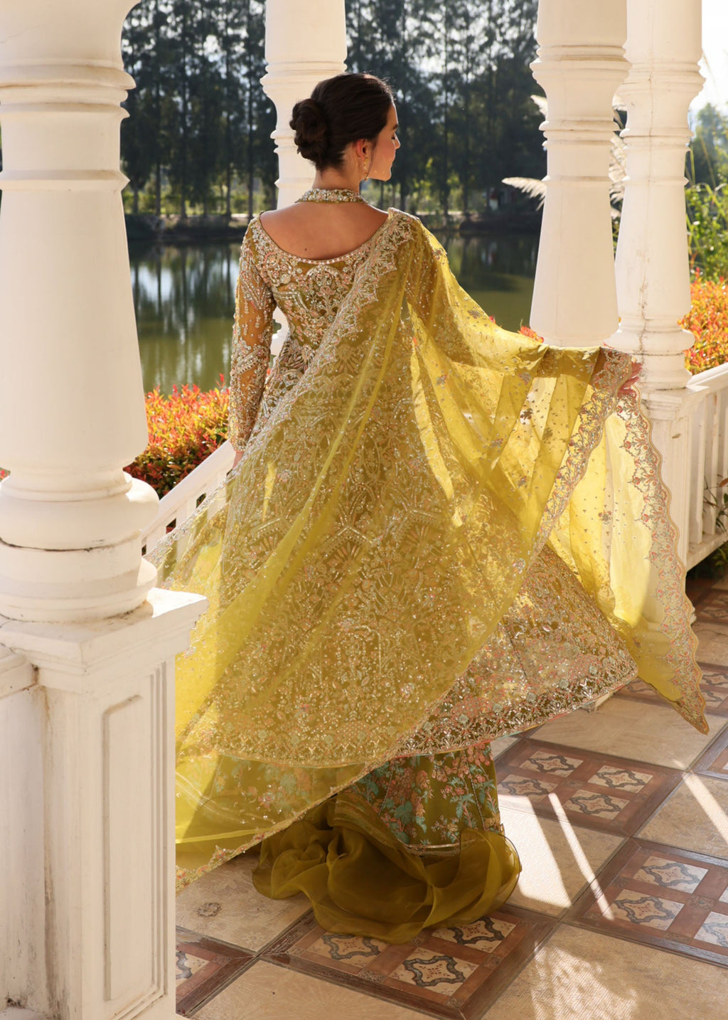 "Close-up profile of the intricately worked sleeves and lower trouser hem from the Kanwal Malik Yashma ensemble, focusing on the sharp contemporary tailoring, clean border trims, and premium raw silk fabric weight."