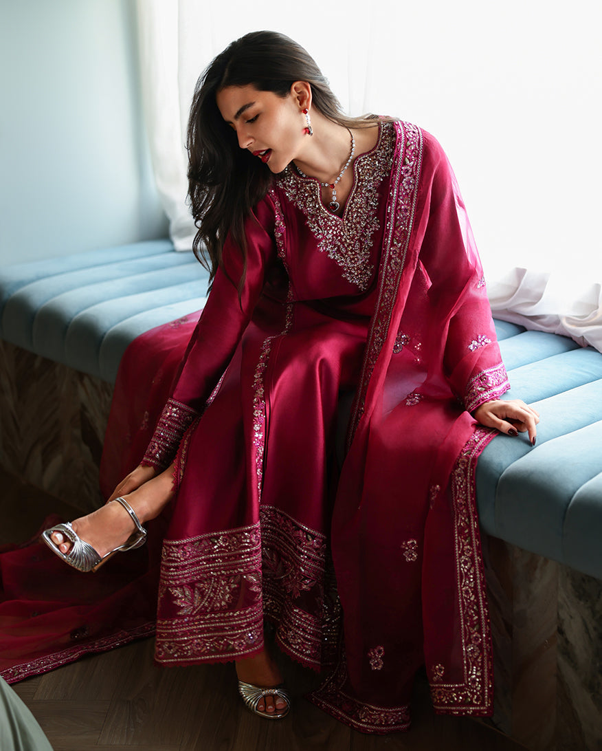 "Focus on the intricate sleeve cuff trimmings and lace hemline details of the Mushq Sereen stitched luxury suit, showing boutique-quality tailoring."