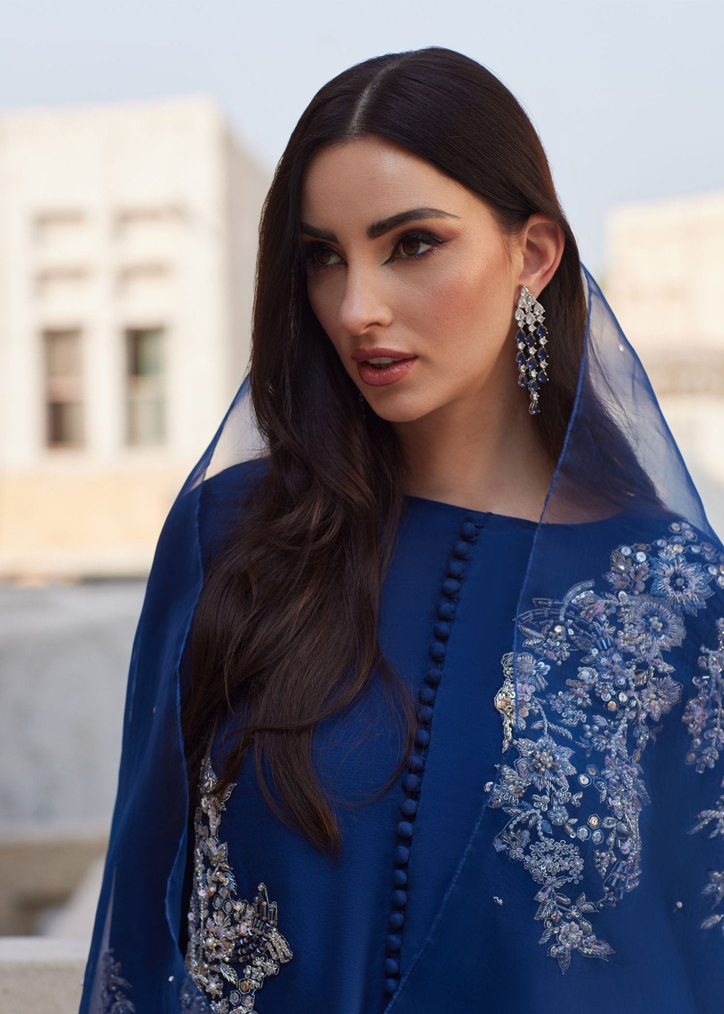 "Side profile and lower look of the Kanwal Malik Huda raw silk outfit, showcasing the clean contemporary tailoring of the matching straight pants and the heavy premium fabric weight."