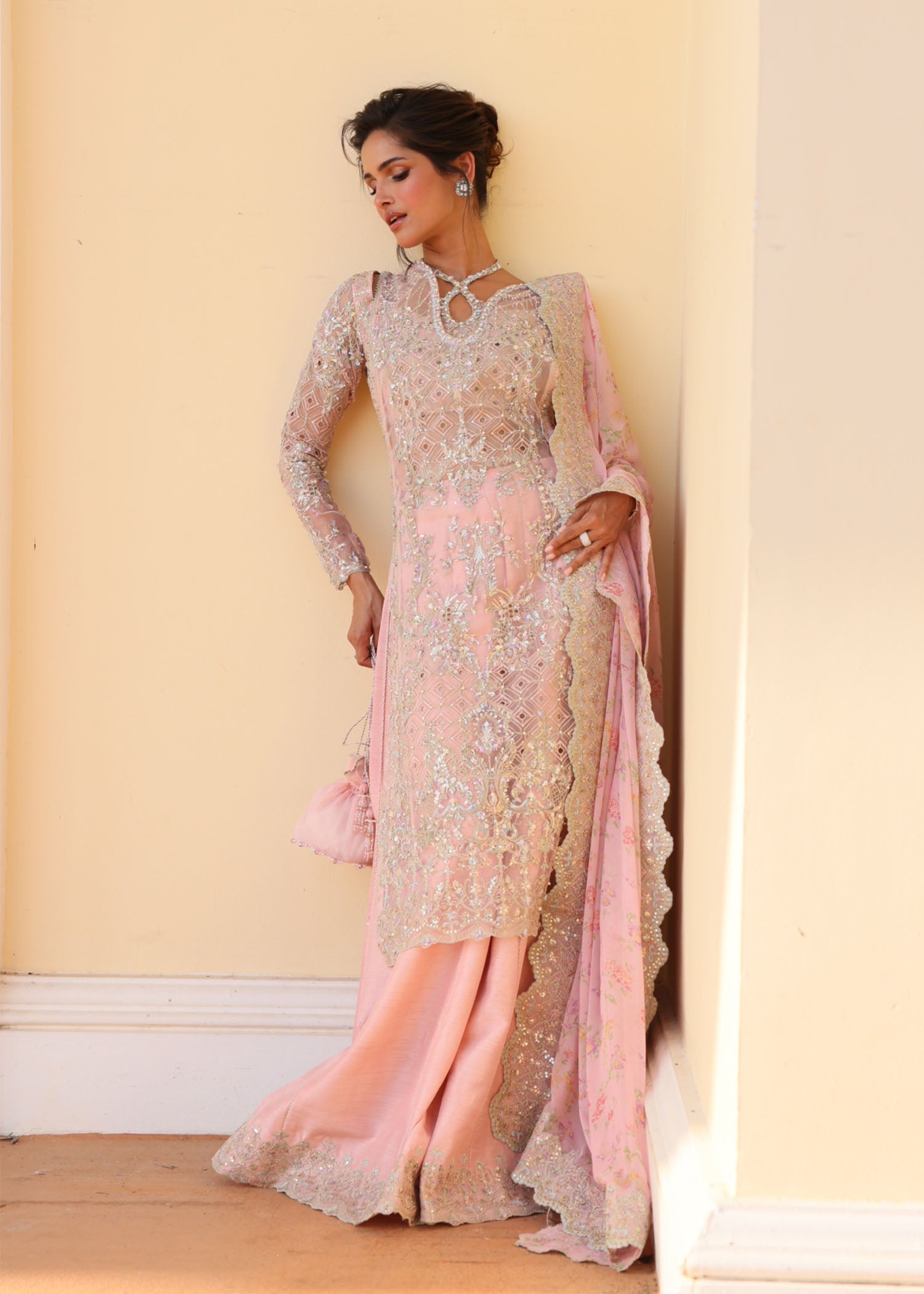 "Detailed view of the premium printed silk dupatta from the Kanwal Malik Marissa collection, emphasizing the vibrant multi-hued border patterns, intricate heritage design elements, and fluid premium drape."