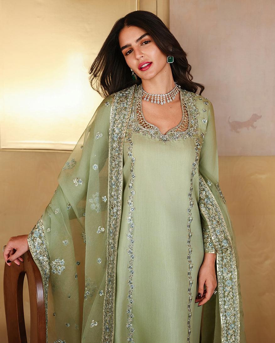 "Focus on the intricate sleeve cuff trimmings and hemline details of the Mushq Veha stitched suit, showing boutique-quality tailoring."