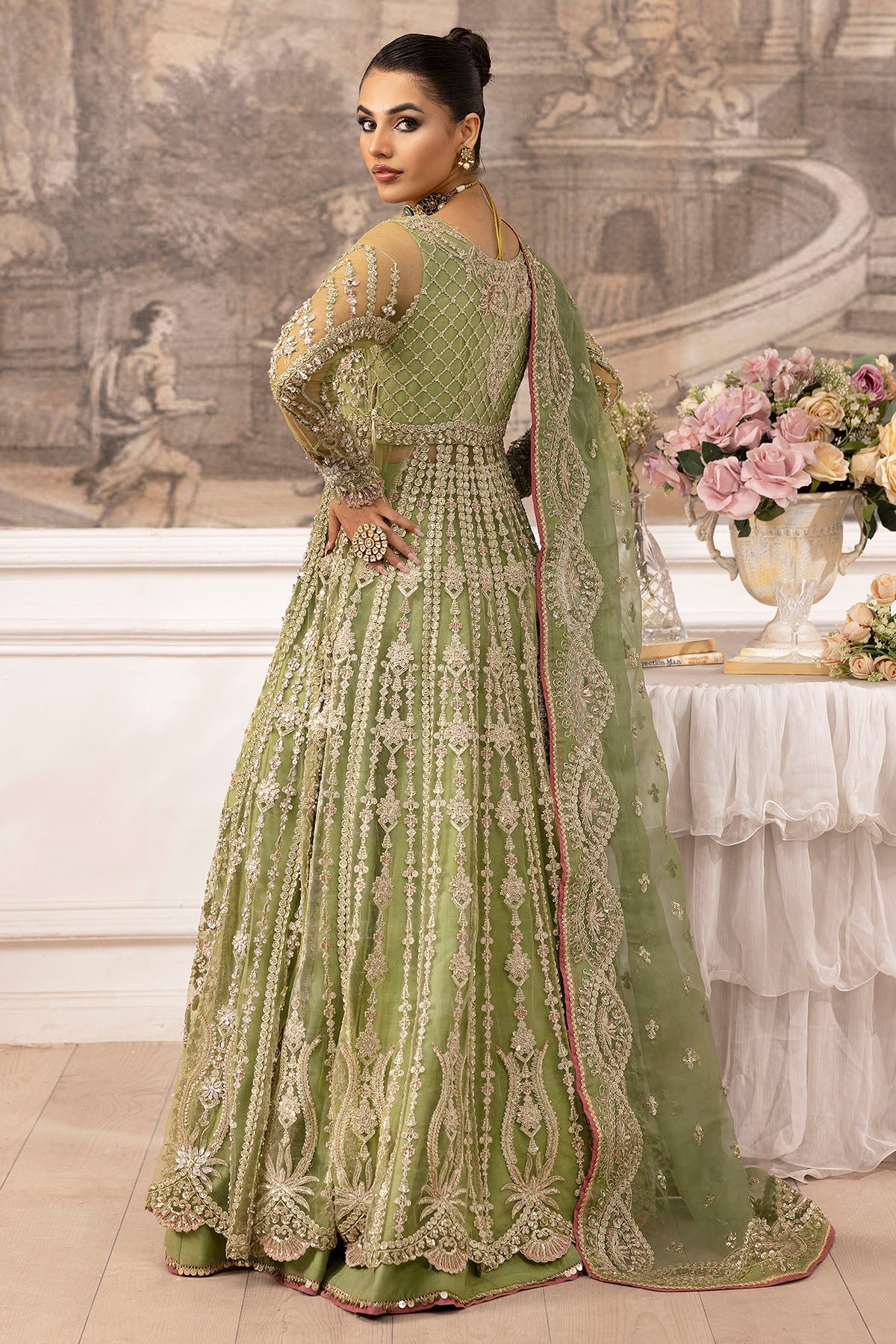 "Focus on the unstitched organza patch borders and sleeve trims of Motifz Iyara, displaying multi-textured embroidered borders and rich fabric textures."