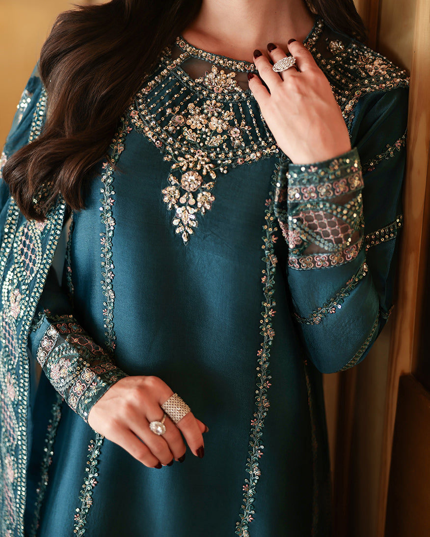 "Focus on the intricate sleeve cuff trimmings and lace hemline details of the Mushq Cyra stitched luxury suit, showing boutique-quality tailoring."
