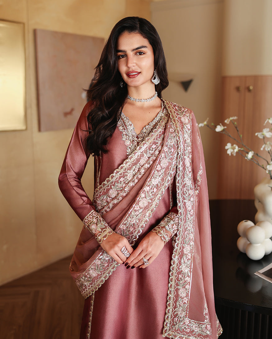 "Focus on the intricate sleeve cuff trimmings and lace hemline details of the Mushq Rowa stitched luxury suit, showing boutique-quality tailoring."