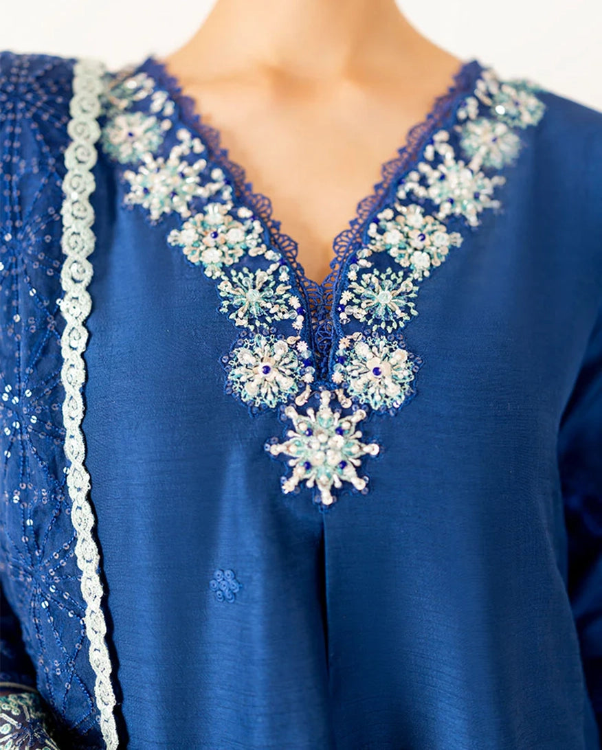 "Close-up detailing on the Mushq Kayra shirt bodice, displaying fine threadwork embroidery, embellished neck finishes, and soft fabric texture."