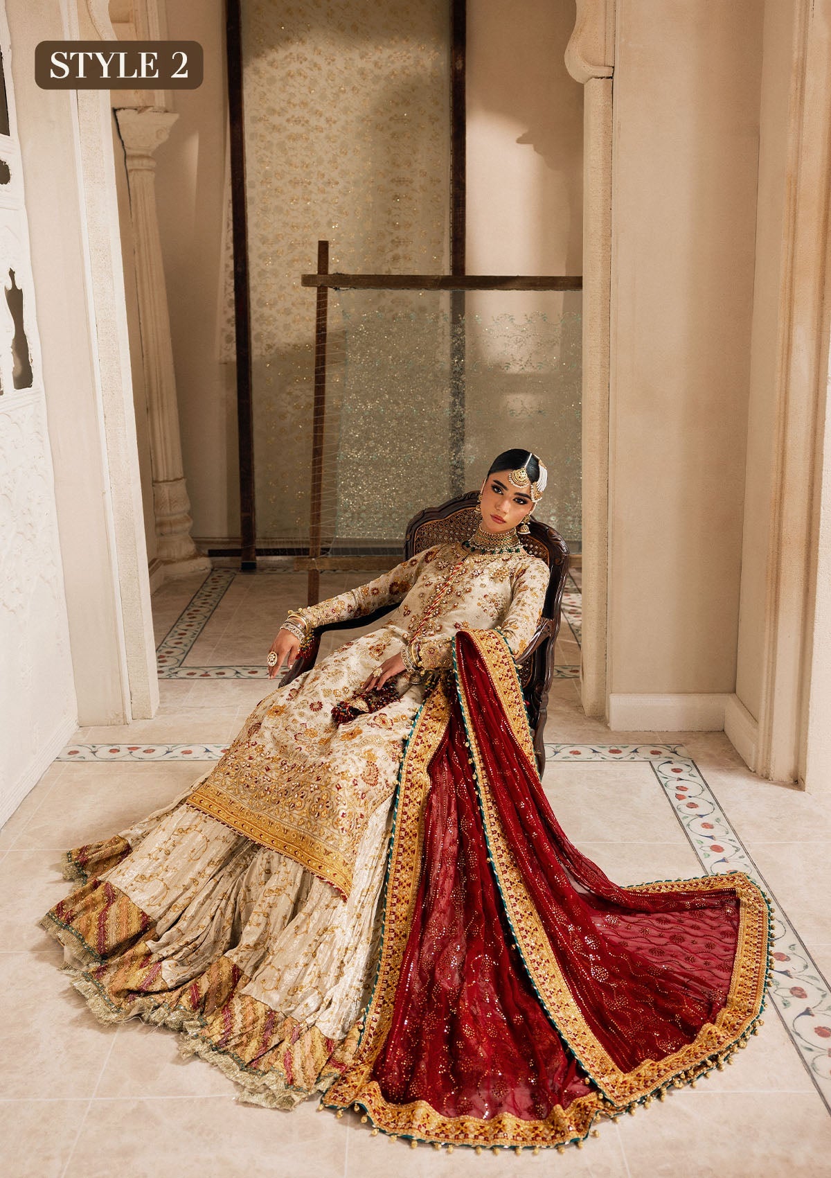 "Lower frame and sleeve profile view of the Aik Wedding Festive Look A2603 ensemble, focusing on the multi-layered embroidered organza patch borders, clean structural stitching, and lace insertions."