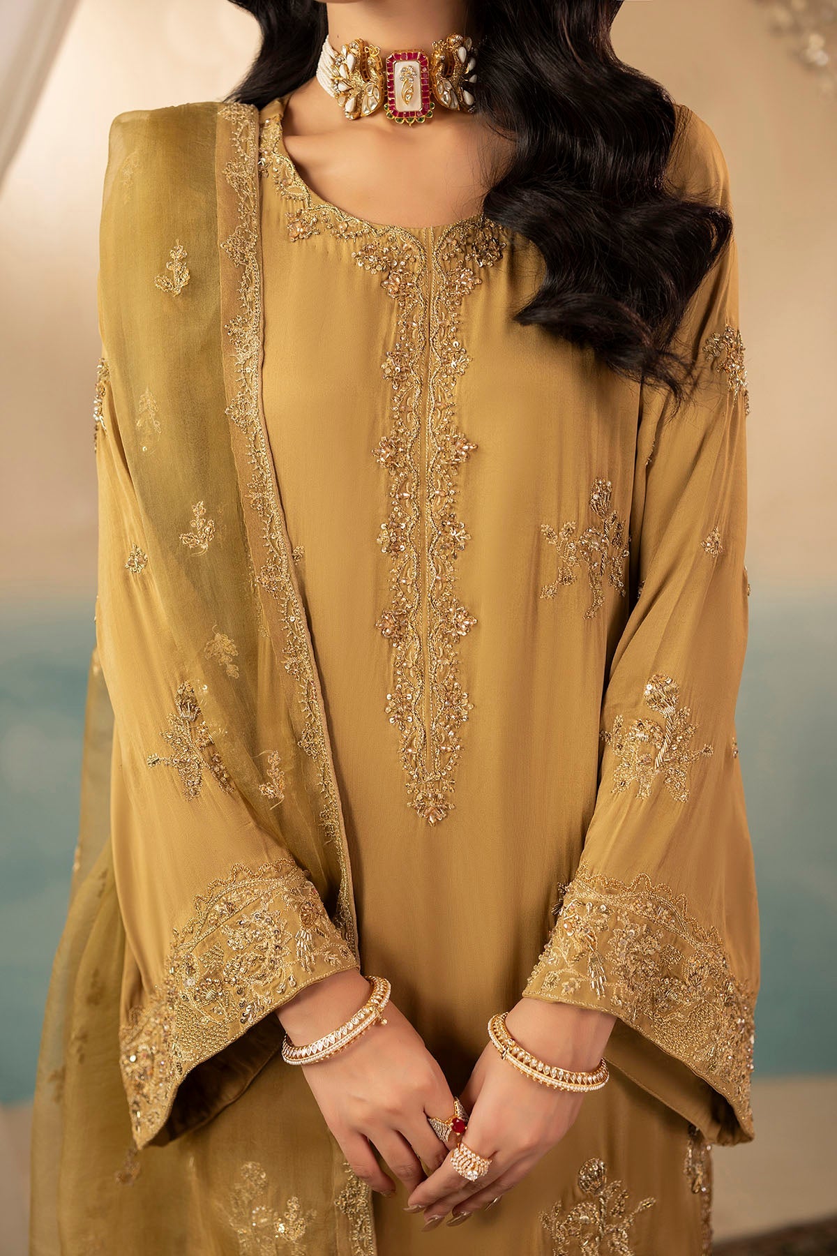 "Close-up detailing on Motifz 0072 Rosa stitched raw silk bodice, highlighting intricate hand-embellished zardozi accents, crystal handwork, and fine tilla embroidery."