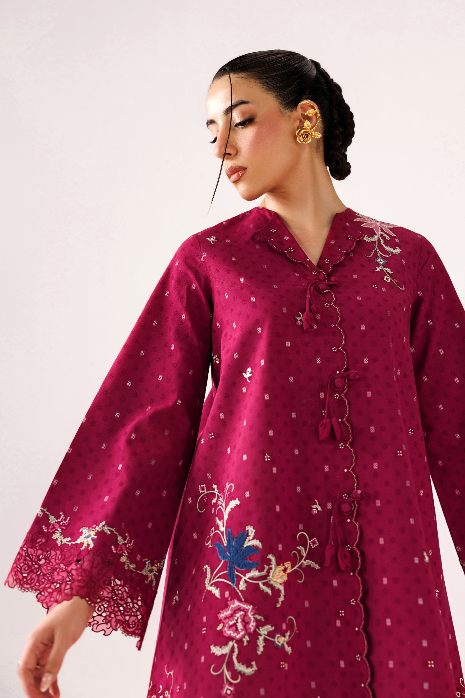 "Focus on the intricate sleeve cuff trimmings and lace hemline details of the Qalamkar QEC-04 Alize stitched luxury suit, showing boutique-quality tailoring."