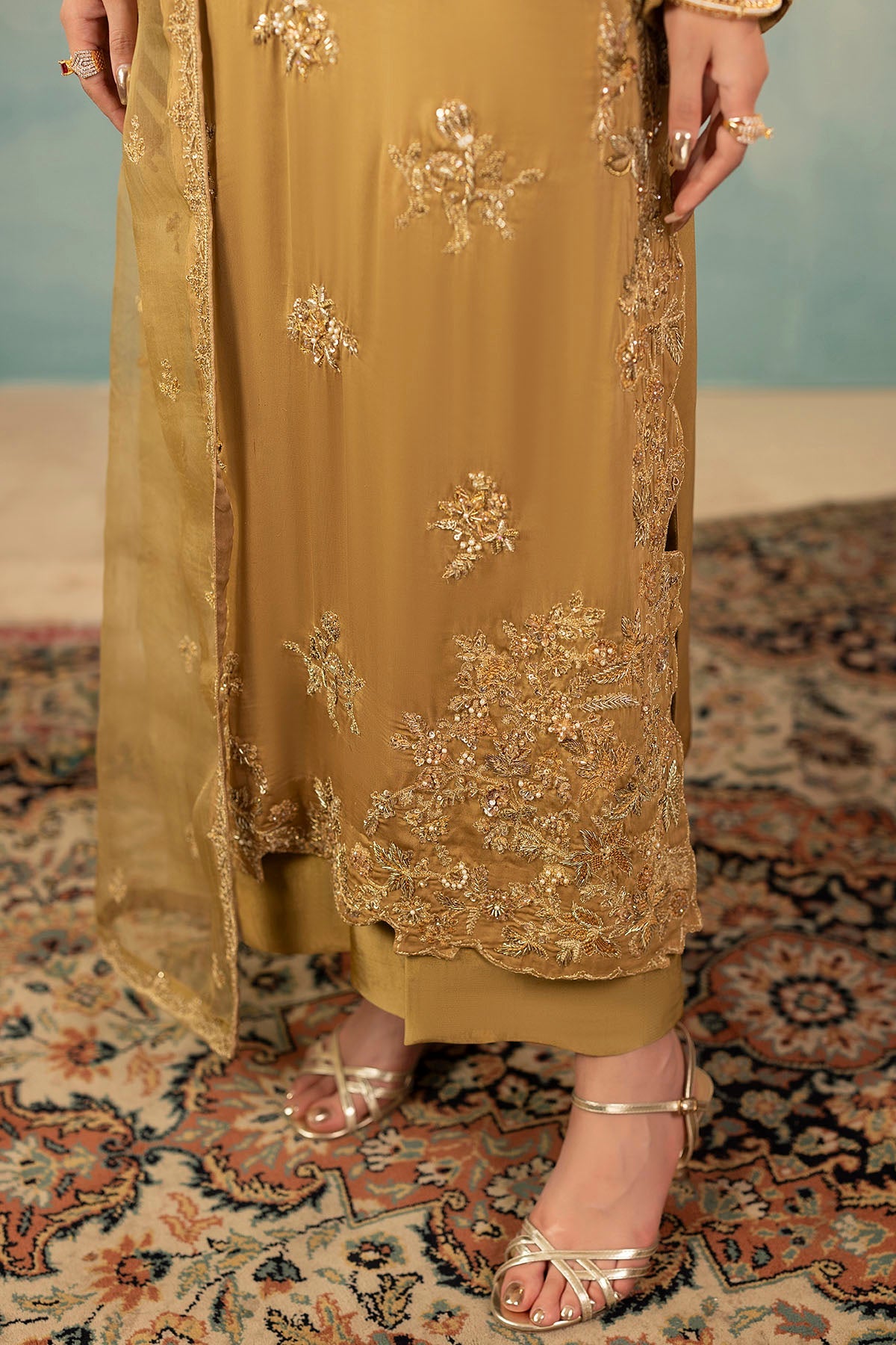 "Focus on sleeve cuffs and hemline patch borders of Motifz 0072 Rosa hand embellished raw silk suit, featuring clean boutique tailoring and organza finishings."