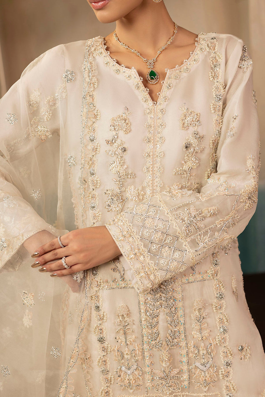 "Close-up detailing on Motifz 0073 Aila stitched organza shirt bodice, highlighting delicate hand embellishments, tilla threadwork, and subtle sequin accents."