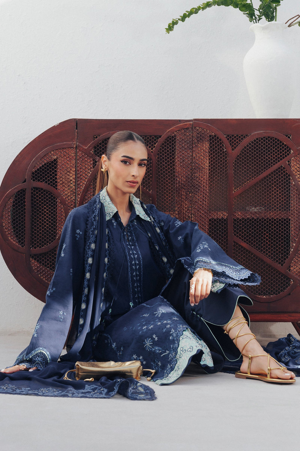 "Focus on the intricate sleeve cuff trimmings and lace hemline details of the Qalamkar QBP-02 DARIA stitched luxury suit, showing boutique-quality tailoring."