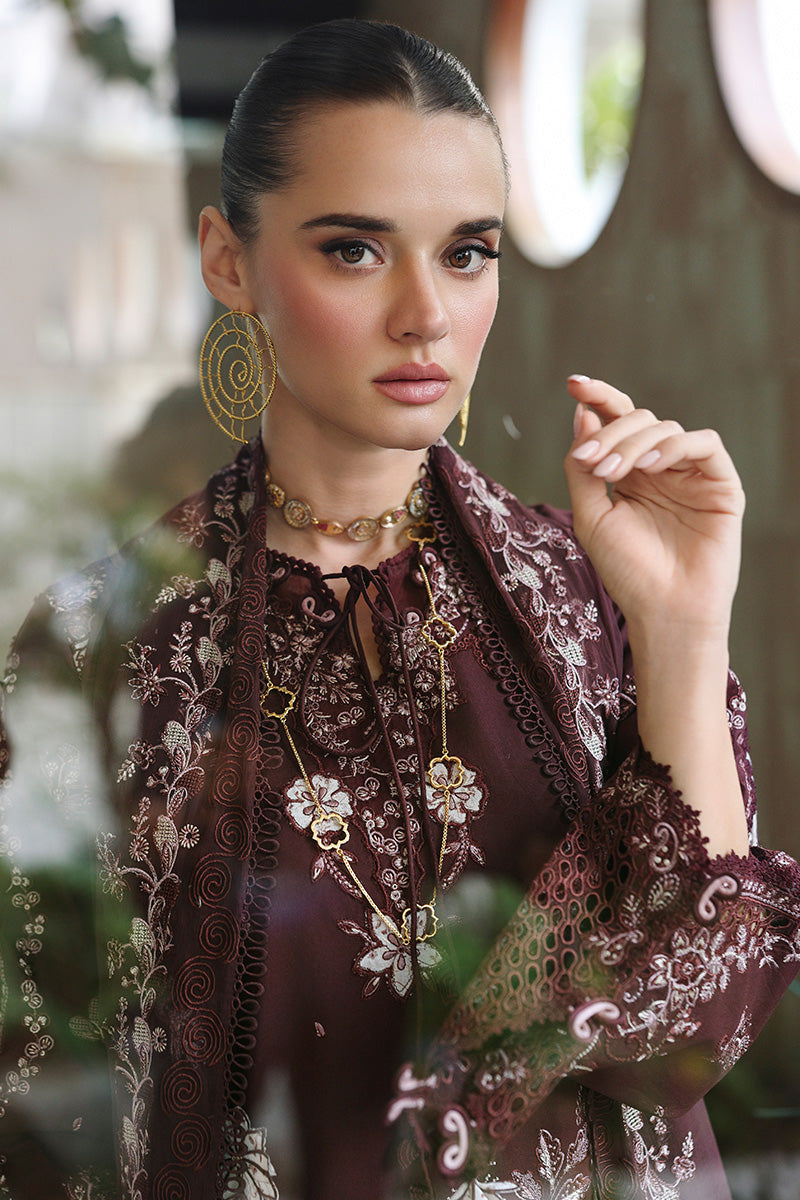 "Focus on the intricate sleeve cuff trimmings and embroidered hemline details of the Qalamkar CM-01 ESHAL stitched luxury suit, showing boutique-quality tailoring."