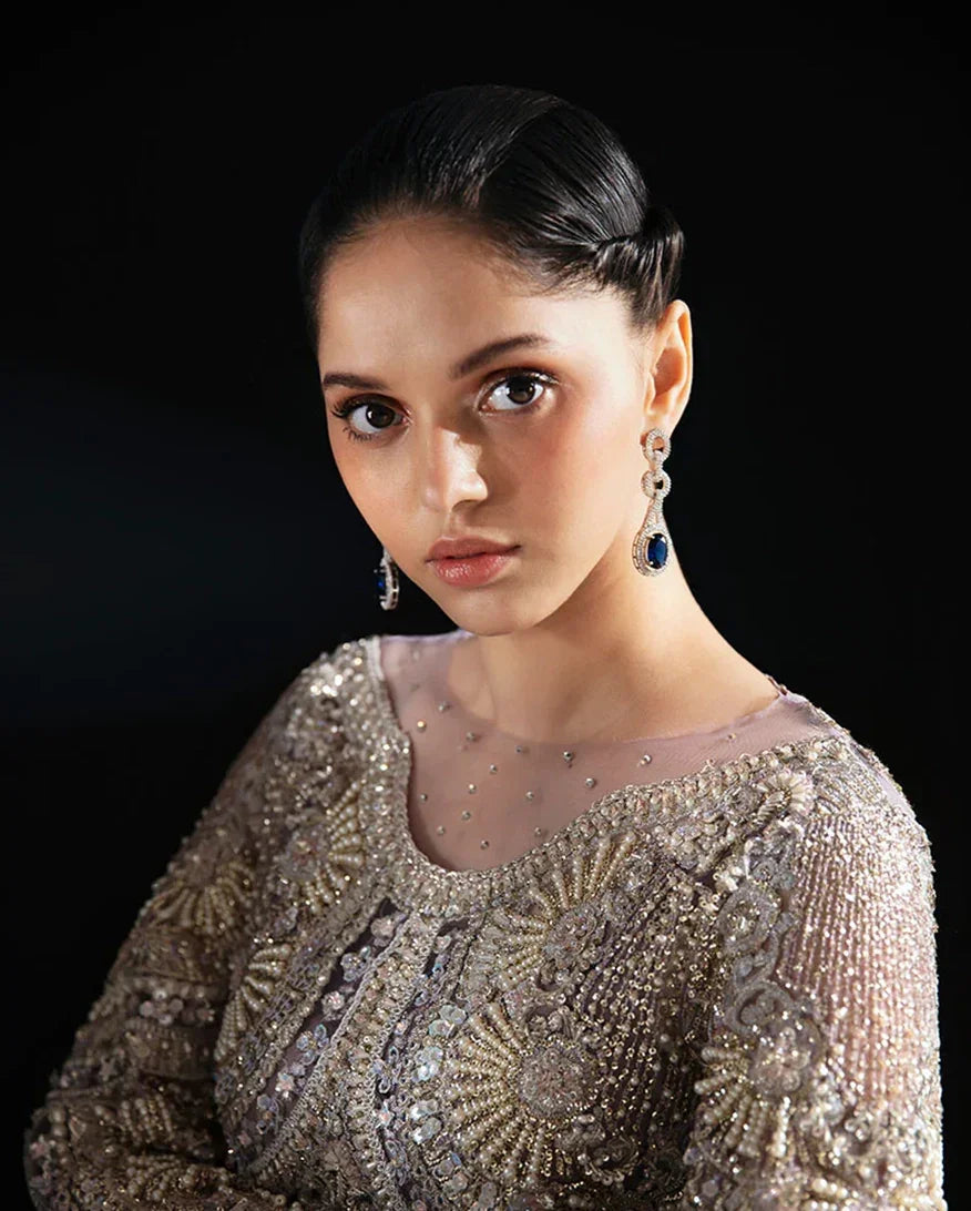 "Close-up detailing on the Mushq Nuru shirt bodice, displaying fine threadwork embroidery, embellished neck finishes, and soft fabric texture."